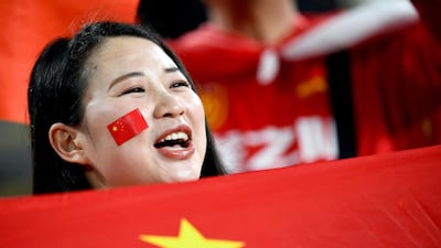 A China supporter waves the national flag during the 2019 Asian Cup quarter-final against Iran at the Mohammed bin Zayed Stadium in Abu Dhabi. AFP
