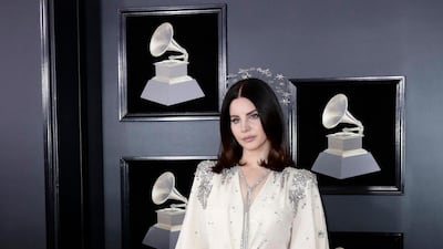 Lana Del Rey opted for a vintage-feel Gucci gown (custom) - we love the mid-length draped sleeves. Jason Szenes / EPA