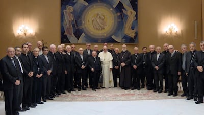 Pope Francis, center, poses for a picture with Chilean Bishops during a meeting at the Vatican. The Bishops announced they had signed a document offering to resign. Pope Francis can accept the resignations one by one, reject them or delay a decision. CTV / via AP