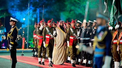 Mohammad bin Salman inspects a guard of honour in Islamabad. EPA