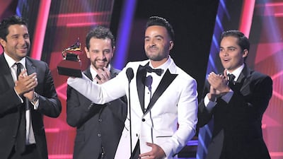 Luis Fonsi with one of four Latin Grammy awards for 'Despacito'. Kevin Winter / Getty Images