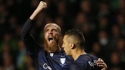 Malmo's Jo Inge Berget celebrates pulling one back for his side late in added time in their 3-2 Champions League play-off first leg loss to Celtic on Wednesday night. Russell Cheyne / Reuters