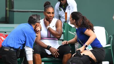 Serena Williams receives medical attention after she retired in the second set of her third round match against Garbine Muguruza. Reuters