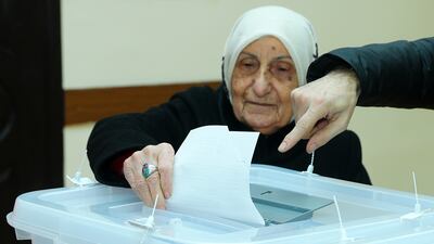 An elderly woman casts her vote in Baku. AP