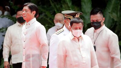 Philippine president Ferdinand Marcos Jr, left, and outgoing president Rodrigo Duterte, right, at the Malacanang Presidential Palace grounds in Manila in June 2022. AP Photo