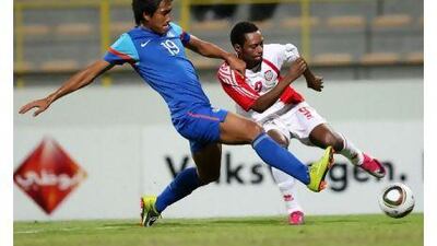 UAE’s Ahmed Jumma, right, and Gouramangi Singh, of India, in hot pursuit of the ball during their friendly in Dubai last night.