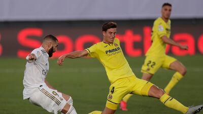 Real Madrid's Karim Benzema, left, shoots to score against Villarreal. AP