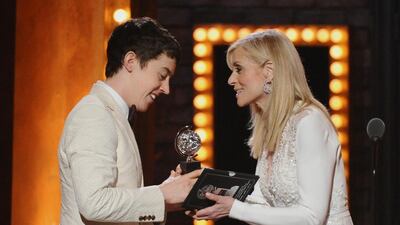 Alex Sharp, left, accepts the award for best performance by an actor in a leading role in a play for The Curious Incident of the Dog in the Night-Time from presenter Judith Light at the 69th annual Tony Awards in New York. Charles Sykes / Invision / AP