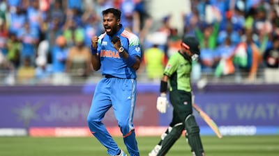 India's Hardik Pandya celebrates after taking the wicket of Pakistan's Saud Shakeel, right, during the ICC Champions Trophy match between Pakistan and India at the Dubai International Stadium in February. AFP