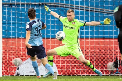 Byer Leverkusen's Finnish goalkeeper Lukas Hradecky makes a save against Borussia Monchengladbach midfielder Florian Neuhaus. AFP