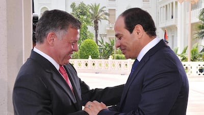 Handout picture from the Jordanian Royal Palace shows Jordan’s King Abdullah II, left, greeting Mr El Sisi, right, at the Presidential Palace in Cairo, Egypt on June 8, 2014 on the day of his inauguration. EPA