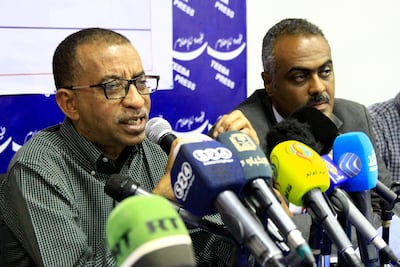 Sudanese activist Omar El Digeir, one of the leaders of the opposition Alliance for Freedom and Change movement, speaks as activist Siddiq Farouk Al Sheikh looks on during a press conference in Khartoum. EPA
