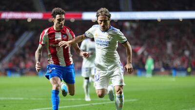 Luka Modric of Real Madrid battles with Sime Vrsaljko of Atletico Madrid. Getty Images