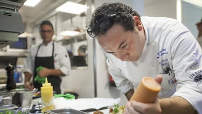 Chef Francesco Guarracino in the kitchen at Bice Mare in Dubai’s Souk Al Bahar. He says he tailors each dish to the diner, anticipating individual tastes according to nationality. Mona Al Marzooqi / The National