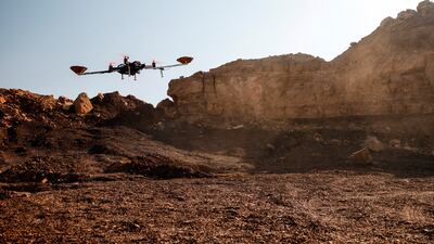 A drone hovers in the desert during an experiment. Reuters