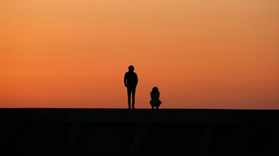 A young couple offers a prayer for victims on a tsunami barrier at Arahama Beach in Sendaii, Miyagi Prefecture. Today is the seventh anniversary of the 9.0-magnitude earthquake and subsequent tsunami, that devastated northeastern Japan and triggered a nuclear disaster at Tokyo Electric Power Company's Fukushima Daiichi Nuclear Power Plant. The earthquake and tsunami killed 15,895 people and 2,539 are still missing. Kimimasa Mayama / EPA