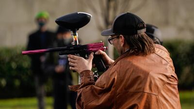 A supporter of President Donald Trump takes aim at counter-protesters during political clashes in Olympia, Washington. AFP