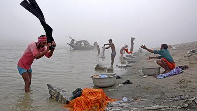 People wash clothes on the banks of the river Brahmaputra on a foggy winter morning in Guwahati, India. Anuwar Hazarika / Reuters