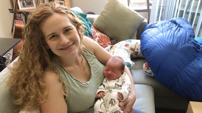 Liz Chrastil, a neuroscientist with the University of California, Irvine, holds her newborn son in May 2020. Liz Chrastil via AP