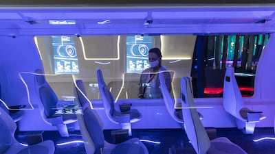 Visitors at Expo 2020 Dubai crowd around a Hyperloop model created by Zeleros, a Spanish start-up. All pictures: Antonie Robertson / The National