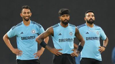 India's Prasidh Krishna, left, Hardik Pandya and Mohammad Siraj, right, during training. AP