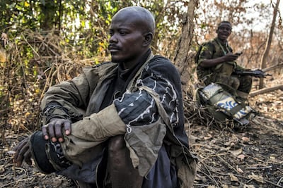 A suspected poacher rests in the shade after being arrested, waiting to be taken to a holding cell. Constant — a father-of-one in his late 30s whose wife is pregnant with their second child — said hunting was the only way he could make ends meet for his family: “There are no opportunities. I do this to survive.” People living around the Chinko reserve are among the most marginalised and impoverished communities in the world. Jack Losh / The National