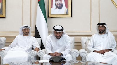Sheikh Mohamed speaks by the phone to Major Hazza Al Mansouri and back-up team astronaut Dr Sultan Al Neyadi from the Sea Palace in Abu Dhabi. He is flanked by Mohammed Al Mansouri, Maj Al Mansouri's brother, (L) and Sheikh Nahyan bin Zayed, Chairman of the Board of Trustees of Zayed bin Sultan Al Nahyan Charitable and Humanitarian Foundation (R). Rashed Al Mansoori / Ministry of Presidential Affairs