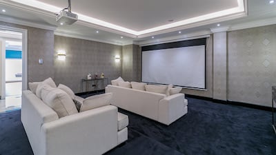 A private cinema room is located downstairs. Courtesy LuxuryProperty.com