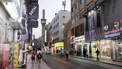 Garment and textile shops in Meena Bazaar, one of Dubai's favourite souqs, where once residents had to get their water by digging a well. Pawan Singh / The National
