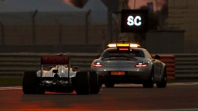 McLaren Formula One driver Lewis Hamilton of Britain drives behind the safety car during the Abu Dhabi F1 Grand Prix at the Yas Marina circuit on Yas Island November 4, 2012. REUTERS/Ahmed Jadallah (UNITED ARAB EMIRATES - Tags: SPORT MOTORSPORT F1) *** Local Caption *** PSQ124_ MOTOR-RACIN_1104_11.JPG