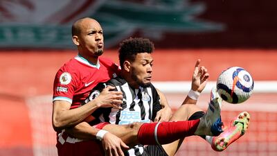 Newcastle attacker Joelinton under pressure from Liverpool's Fabinho. Reuters