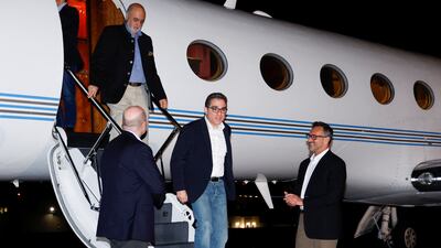 US Special Presidential Envoy for Hostage Affairs Roger Carstens greets freed Americans Siamak Namazi, Morad Tahbaz and Emad Shargi who were released in a prisoner swap deal with Iran, at Fort Belvoir, Virginia. Reuters