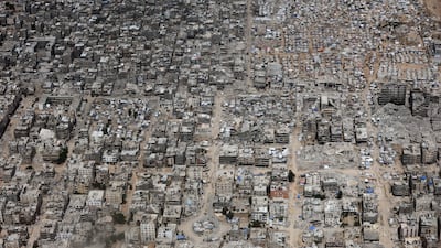 Jordanian Air Force personnel carry out an airdrop of aid in a military plane over Gaza. Getty Images