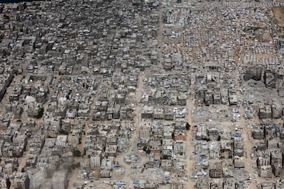 Destruction of Gaza as seen from a Jordanian military plane as it performs an air drop of humanitarian supplies. Getty Images
