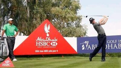 Rory McIlroy, above right, started off well, winning the Abu Dhabi HSBC Golf Championship, .