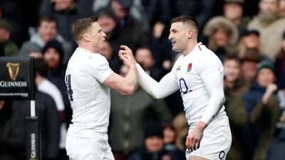 England's Jonny May celebrates scoring their third try to complete his hat-trick with Chris Ashton Action. Reuters