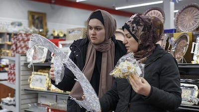 Zeinab Assi (L) stands next to her mother, Kay Dourra, while shopping for Ramadan decorations at Heights Kitchenware on the first day of Ramadan on April 23, 2020 in Dearborn Heights, Michigan. Getty Images via AFP