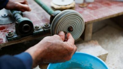Mr Suaan, who retired from the Iraqi army in 2018 after helping to oust ISIS from Mosul, works on a stone