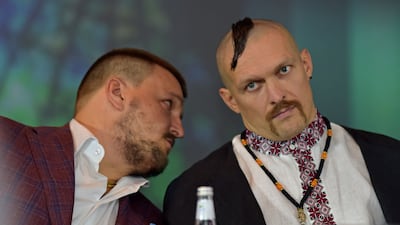 Promoter Alexander Krassyuk speaks with Oleksandr Usyk, AFP