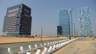 Hiranandani Signature Tower, left, in Gujarat International Finance Tec-City, located at Gandhinagar, 30 kilometres from Ahmedabad, the capital of Gujarat state. Sam Panthaky / AFP