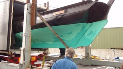 The Galway Hooker 'Little Nora' being loaded into a 40-foot container in Ireland to start her journey to the UAE for the Abu Dhabi stopover of the Volvo Ocean Race.