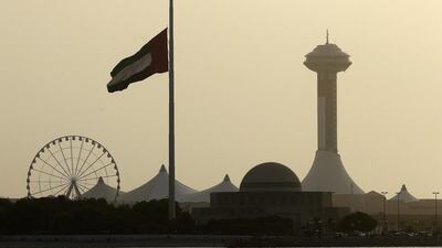 The giant flag near Abu Dhabi’s Marina Mall flies at half-mast during the three-day mourning period. Ravindranath K / The National