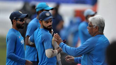 India’s captain Virat Kohli, centre, checks his bat during a team practice session on the eve of a Test match against Bangladesh on February 8, 2017. Noah Seelam / Getty