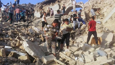 People pick through the rubble of the destroyed Mosque of The Prophet Younis, or Jonah, in Mosul, Iraq, on July 24, 2014. The revered Muslim shrine was destroyed by militants who overran the city in June and imposed their harsh interpretation of Islamic law. The mosque was built on an archaeological site dating back to 8th century BC, and is said to be the burial place of the prophet, who in stories from the Bible and Quran is swallowed by a whale. Associated Press, file