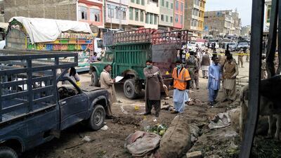 Members of a bomb disposal unit survey the site of a blast at a market in Quetta, Pakistan on April 12, 2019. Reuters
