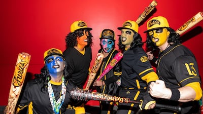 Attendees dressed as the Baseball Furies from 'The Warriors' pose during New York Comic Con. AP