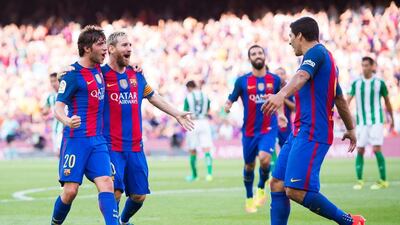 Sergi Robert, left, produced two assists in the first half, while Lionel Messi scored twice and Luis Suarez scored a hat-trick. Alex Caparros / Getty Images