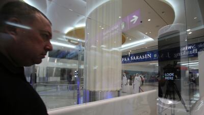A passenger walks through the smart tunnel. AP Photo