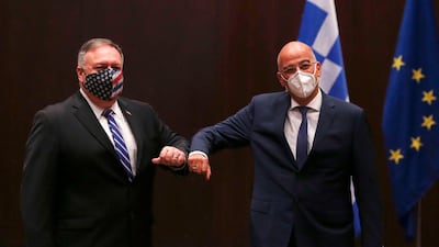 US Secretary of State Mike Pompeo (L) and Greek Foreign Minister Nikos Dendias touch elbows during their meeting in the northern city of Thessaloniki, on September 28, 2020. AFP