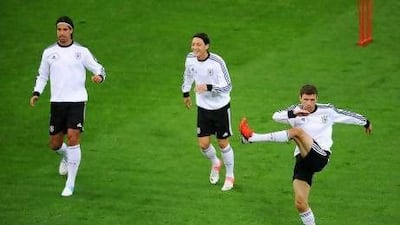 Sami Khedira, left, Mesut Ozil, centre, and Thomas Muller have been central to Germany's recent successes, but they are all still very young while their squad has plenty of options for each position. Christopher Lee / Getty Images